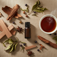 Darjeeling essential oil lifestyle flat lay with sandalwood, cedarwood and Darjeeling tea by Escents Aromatherapy